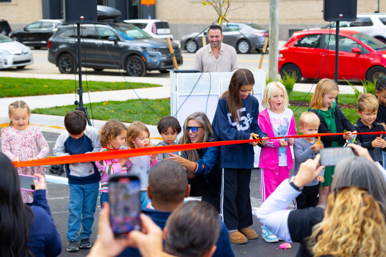 Kintsugi Village ribbon cutting with founding children.